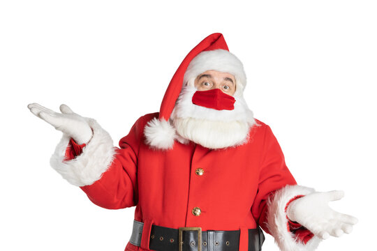 Man in a Santa Claus costume and mask with incomprehensive expression isolated on a white background.