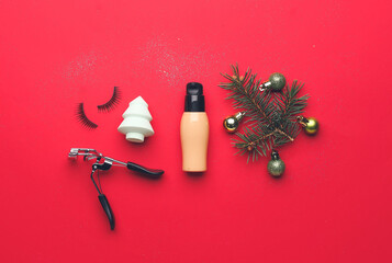 Christmas composition with cosmetics on color background