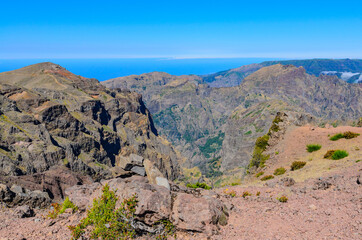 Beautiful mountain landscape with Arieiro peak in the background the Atlantic Ocean.