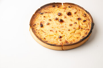 delicious round quiche with ham and homemade bacon