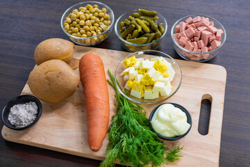 side view, products for the traditional Russian New Year and Christmas salad, Olivier, decorated with parsley, New Year and Christmas celebration in Thailand, vegetarian and vegan egg