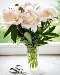 Beautiful pink peony bouquet in a vase.