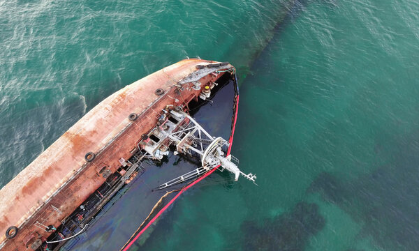A sunken tanker that hit the shore with a storm. Coastal pollution by oil. Ecological catastrophe.