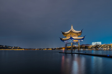 Night view of Jixian pavilion, the landmark at the west lake in Hangzhou, China.