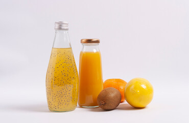 Citrus juice and fruits on wooden background. Selective focus.  Horizontal orientation.