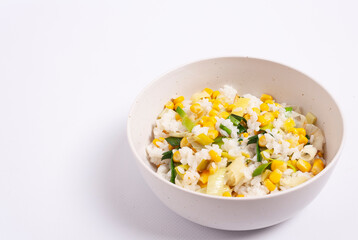 Risotto on a white plate, salt shaker. The view from the top.
