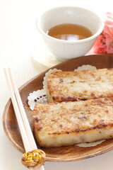 Chinese New Year food, turnip cake on dish also for dim sum yam cha cuisine