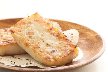 Chinese New Year food, turnip cake on dish also for dim sum yam cha cuisine