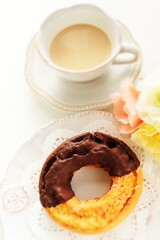 Chocolate old fashion donut on dish with copy space