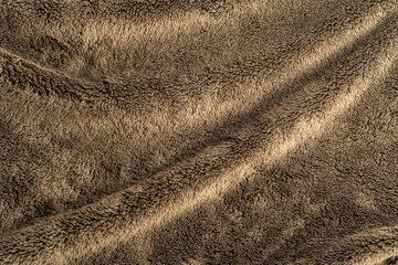 Faux fur. Textured surface with folds. Abstract background, swamp color