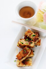 Chinese New Year food, turnip cake on dish also for dim sum yam cha cuisine