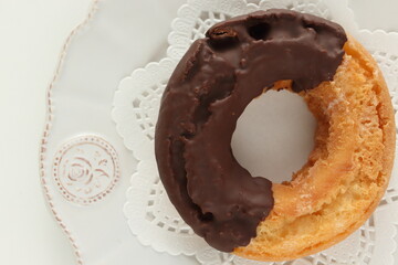 Chocolate old fashion donut on dish with copy space