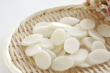 Korean food ingredient, Tteok sliced rice cake on bamboo basket