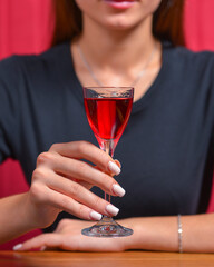 Girl with cocktail, still life concept. Drinking alcohol fruit drink in a restaurant. Eating out concept.