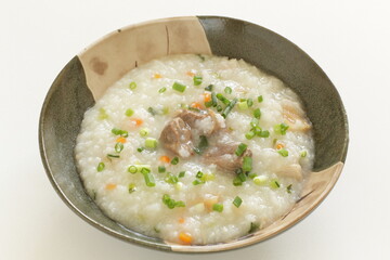 Chinese food, meat and congee with green onion and carrot