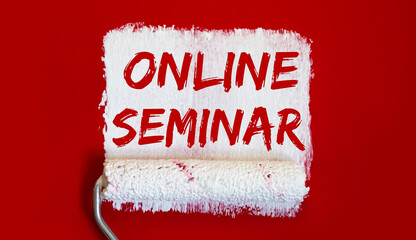 ONLINE SEMINAR .One open can of paint with white brush on red background. Top view.