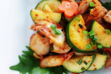 Korean food, cucumber and chicken stir fried with kimchi
