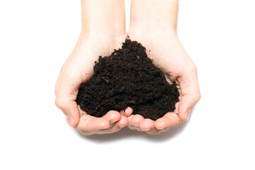 female hands holding in palms of fertile soil in shape of heart on white background. Top view.