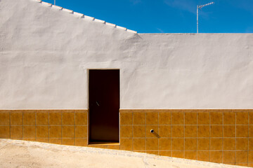 White wall of an Andalusian house in Olvera, one of the white towns in Cádiz, south of Spain.