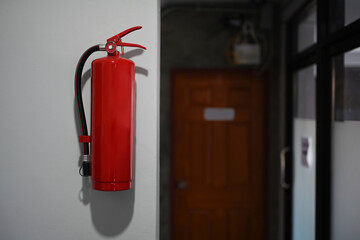 Red fire extinguishers tank for safety and fire prevention in a modern building.