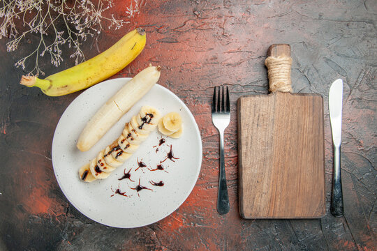 top view delicious banana with sliced pieces inside plate on dark background tree photo fruit sweet