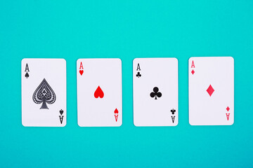Playing cards on blue background. Poker of aces.