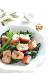 Chinese food, fish cake and green leaf vegetable Spinach stir fried
