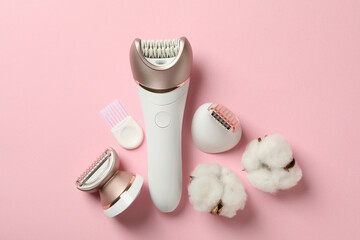 Epilator with nozzles on pink background, space for text - obrazy, fototapety, plakaty