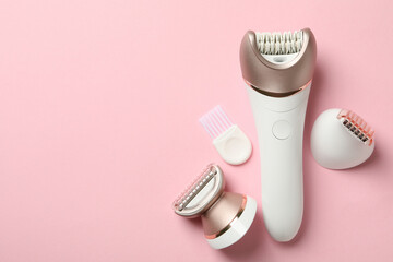 Epilator with nozzles on pink background, space for text