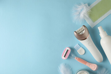 Different shaving accessories on blue background, space for text