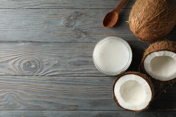Fresh coconut and coconut milk on wooden background