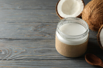 Fresh coconut and coconut milk on wooden background
