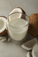 Fresh coconut and coconut milk on white background