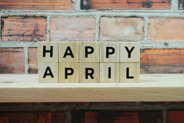 Fototapeta na wymiar Happy April alphabet letter on shelves wooden background