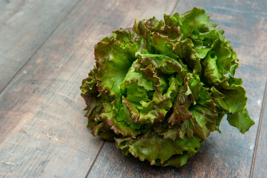 lettuce head over rustic wooden background