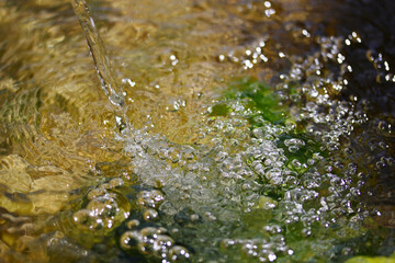 Bubbles in the water. Water background. Fresh drinking water.