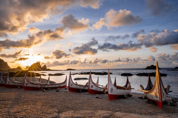 The traditional canoes of the aboriginal Tao tribe during sunrise in Taiwan. The traditional canoes...