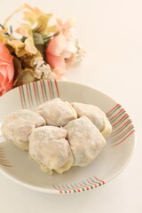 Chinese food, homemade wonton dumpling ingredient on dish
