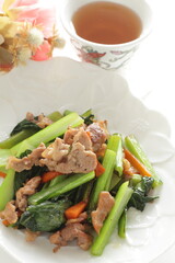 Chinese food, pork and green leaves vegetable stir fried 