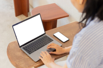 computer screen,cell phone blank mockup.hand woman work using laptop texting mobile.with white background for advertising,contact business search information on desk in cafe.marketing,design