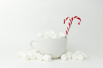 Marshmallow in the cup on the white background