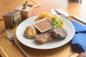 Mixed grill steak with Black pepper sauce on the Table