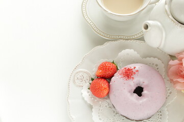 Pink strawberry chocolate coating donut served with strawberry