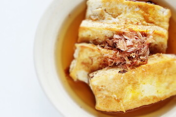 Japanese food, pan fried tofu and soy sauce with Katsuobushi