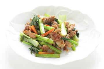 Chinese food, pork and green leaves vegetable stir fried