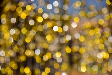 Gold glitter vintage lights background. defocused