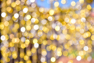 Gold glitter vintage lights background. defocused
