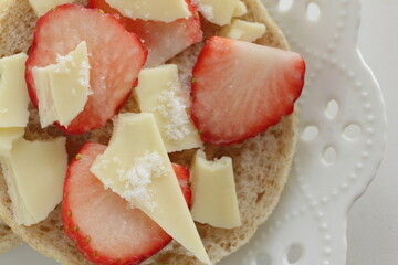 homemade sugar and cheese with strawberry in English muffin sandwich
