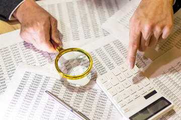 Analysing of accounting and financial documents, diagrams with magnifier. economy research