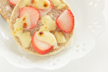homemade sugar and cheese with strawberry in English muffin sandwich